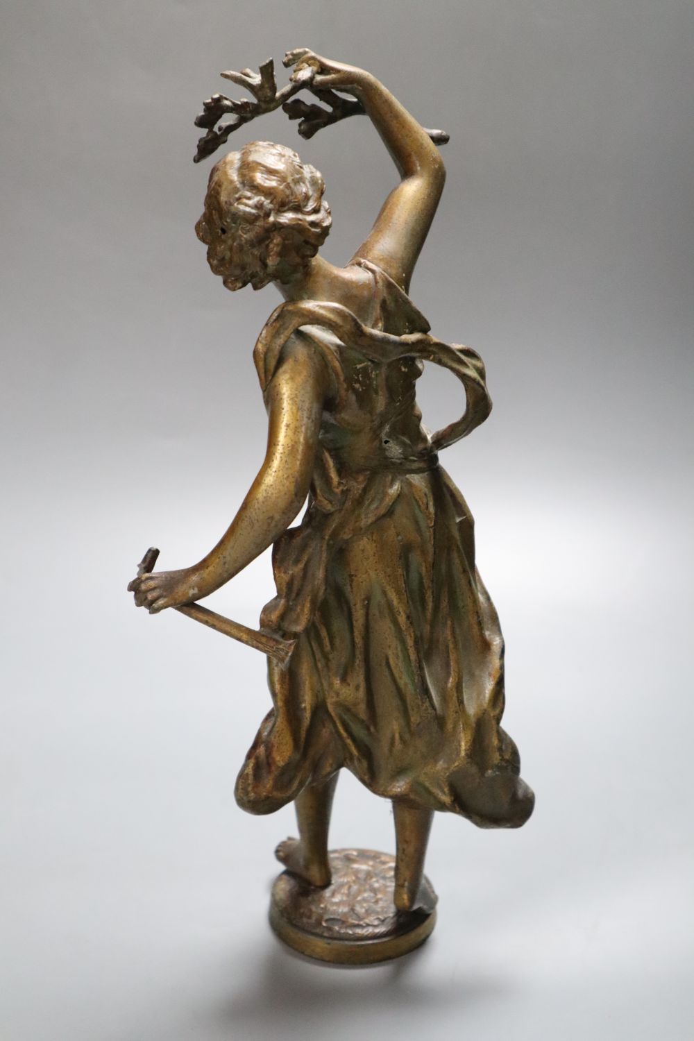 A 20th century spelter figure of Flora, height 34cm with associated stand
